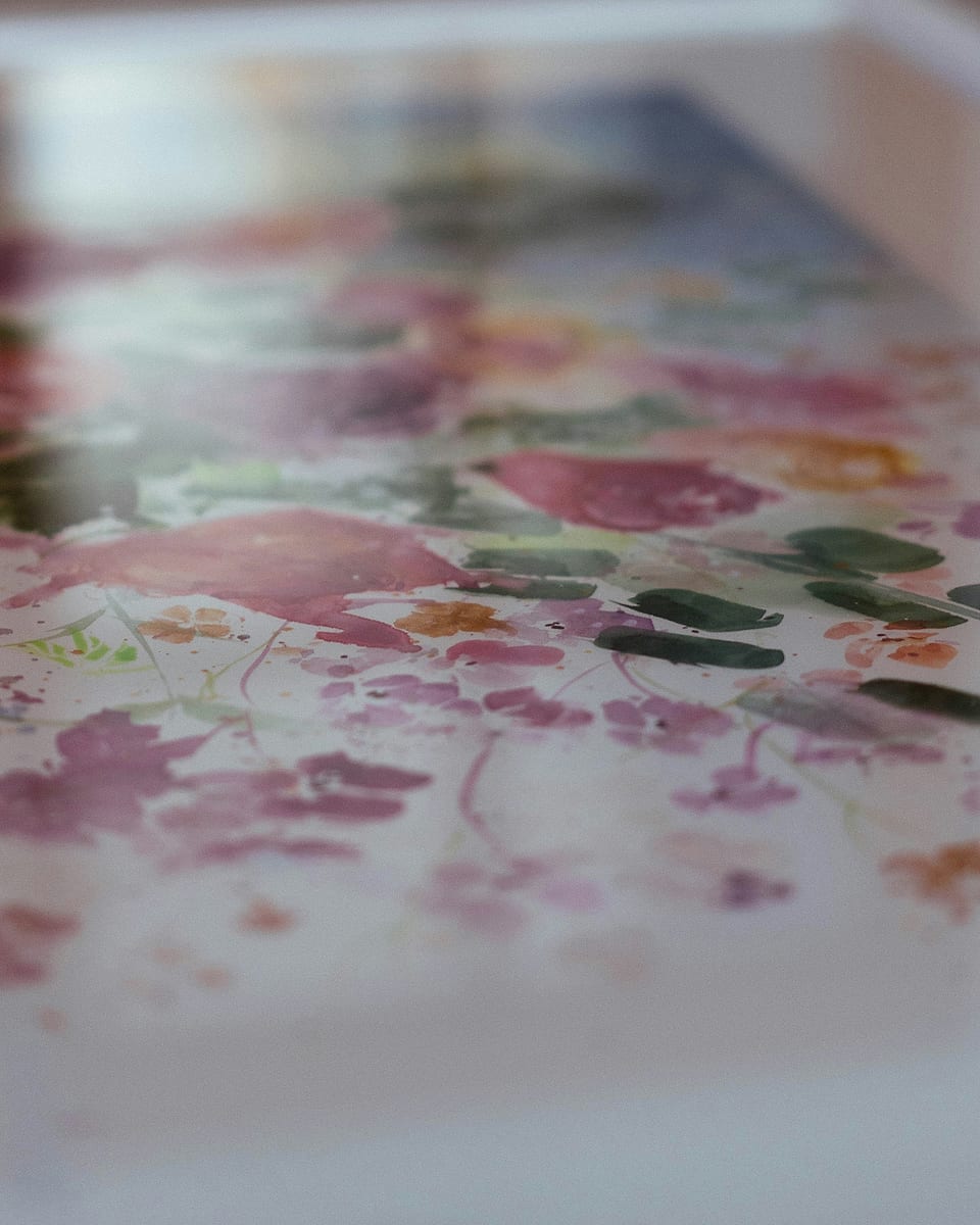 A glass framed print with a mat, seen at a low angle