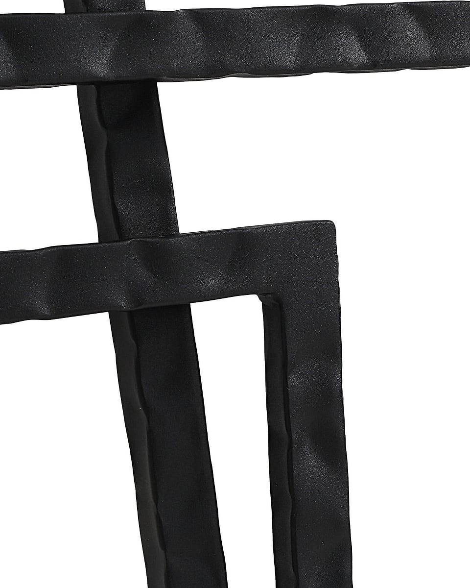 Hammered black iron on a metal wall piece