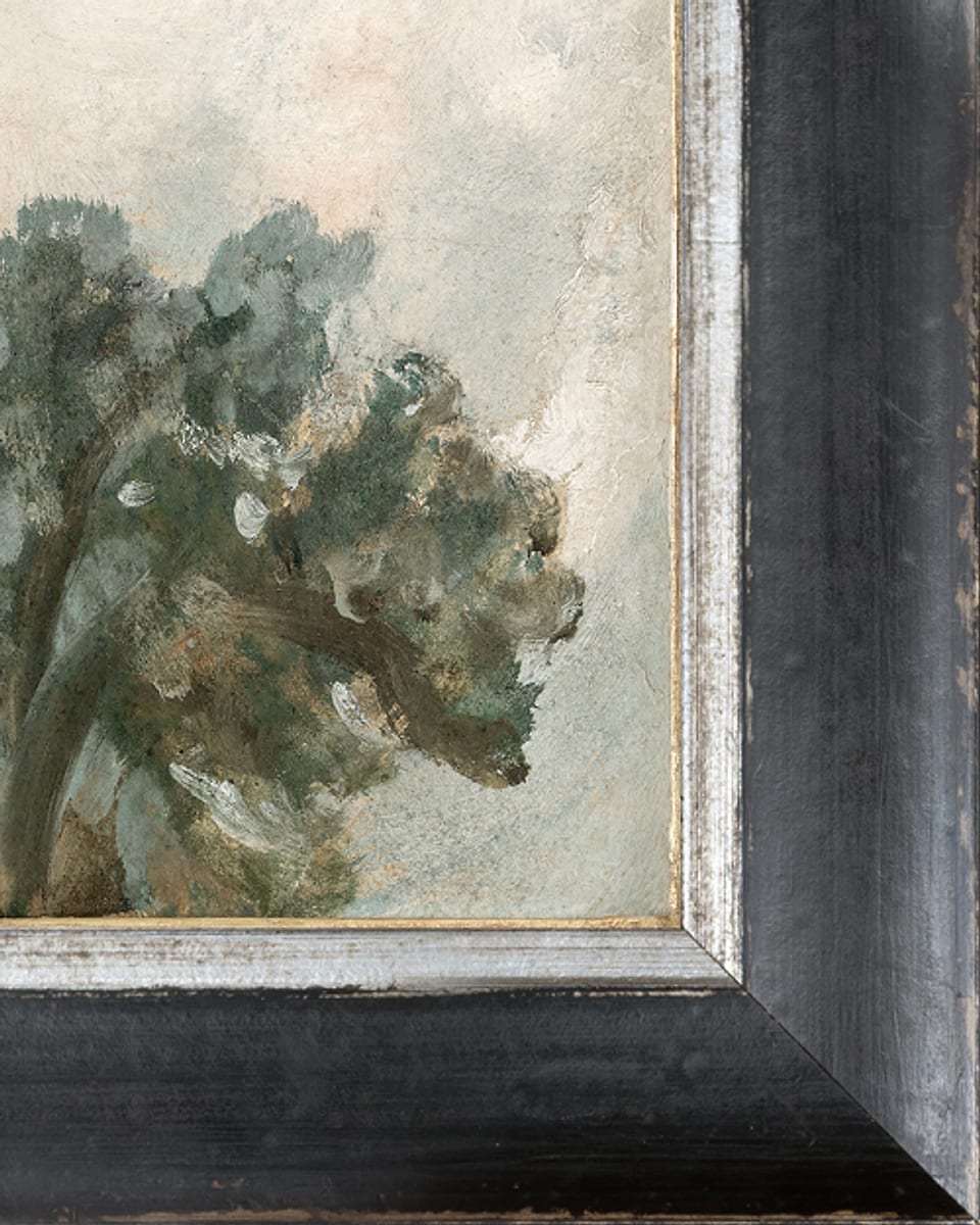 A petite canvas on board in a black and silver frame